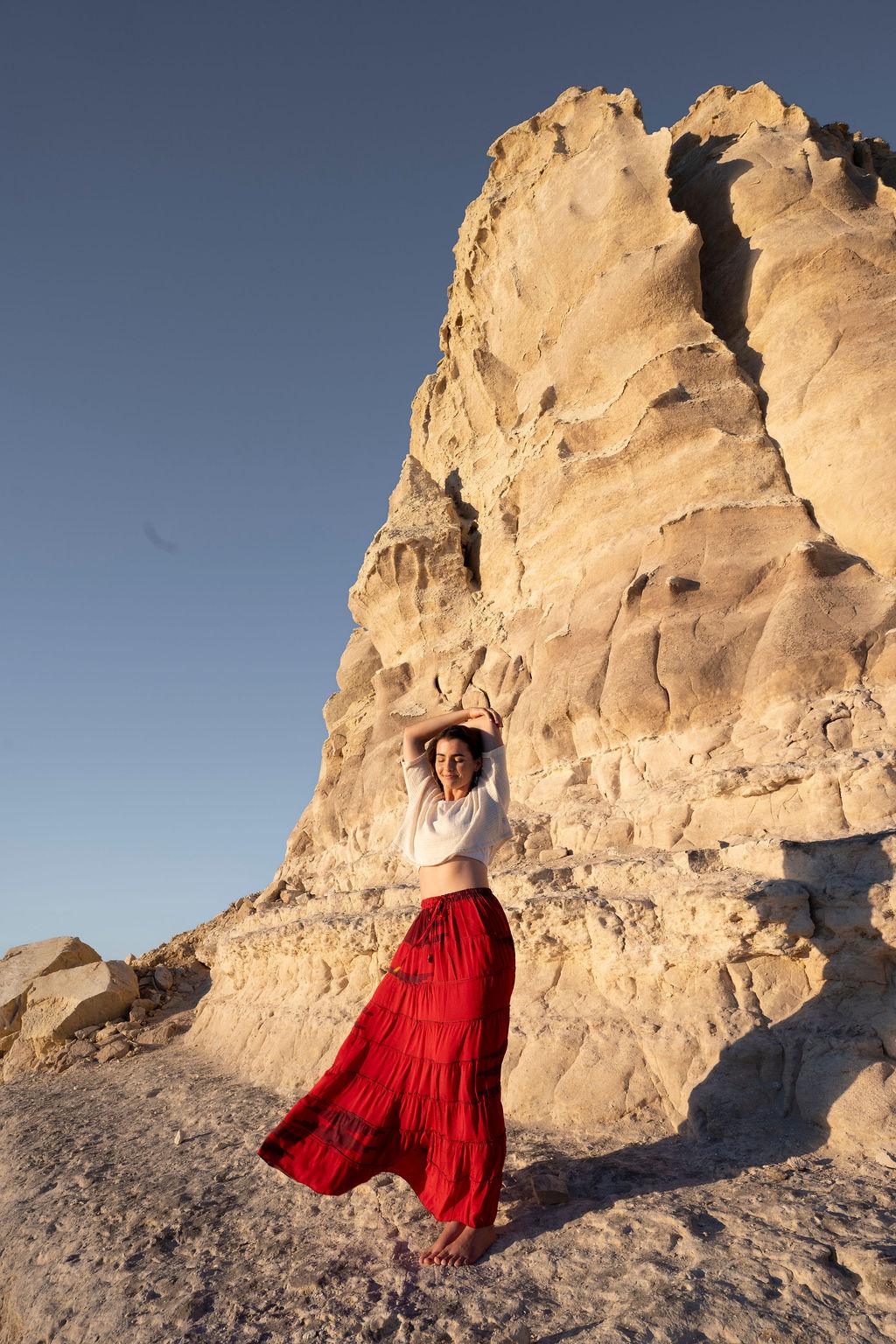 Madder-red silk skirt in the wind